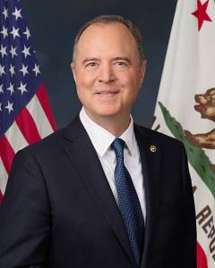 Official portrait of U.S. Representative Adam Schiff in front of American and California state flags.