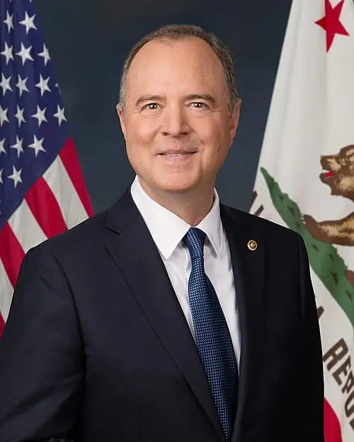 Official portrait of U.S. Representative Adam Schiff in front of American and California state flags.