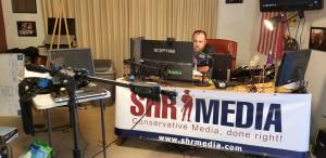 Sack Head Shaun broadcasting from the SHR Media studio during 2018 midterm election coverage.