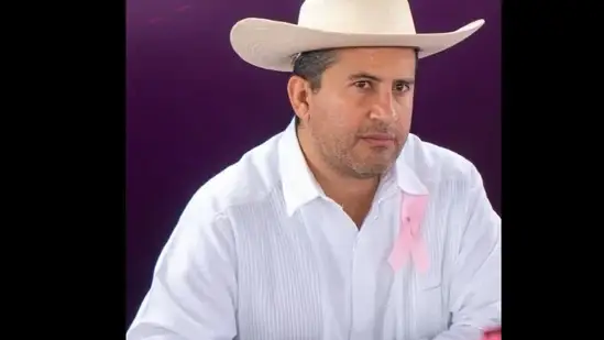 arlos Manzo Rodríguez, mayor of Uruapan, wearing a white shirt and traditional hat, photographed before his assassination after publicly opposing drug cartels in Michoacán, Mexico
