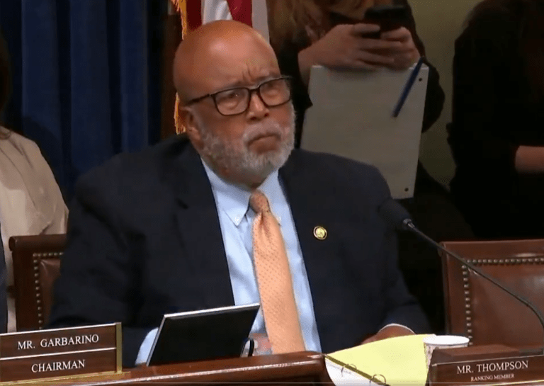Rep. Bennie Thompson sitting at a committee desk during a House hearing, looking forward with a serious expression.