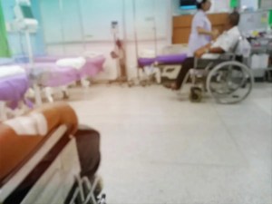 Patients wait in a crowded Canadian hospital hallway amid prolonged medical delays linked to thousands of deaths before treatment.